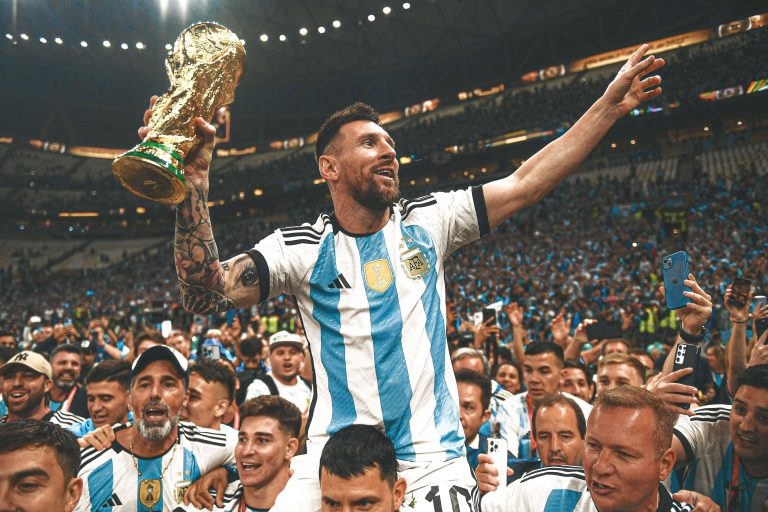 lionel-messi-lifiting-the-2022-fifa-world-cup-trophy-v0-6ib1hrf1bu6a1
